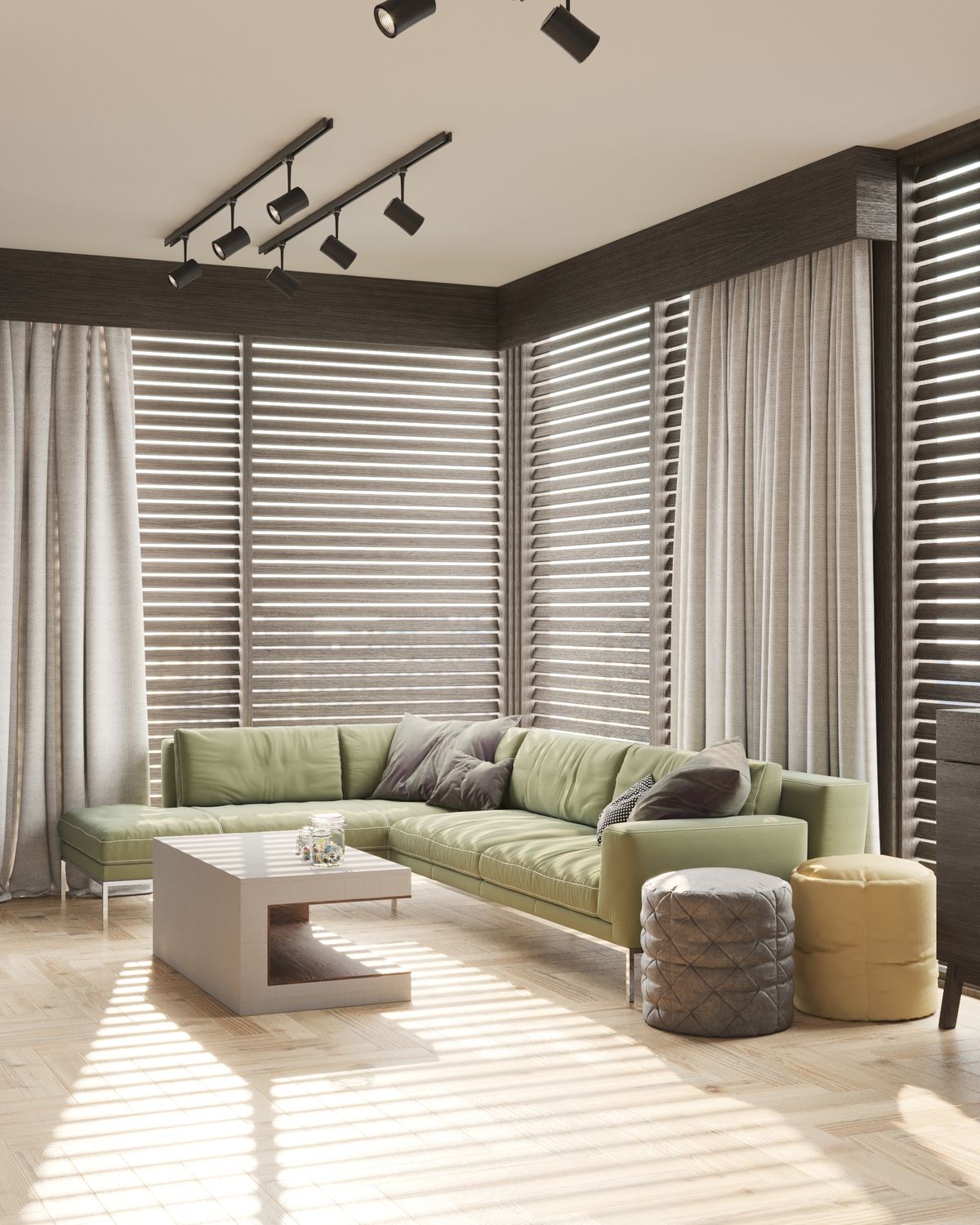 Living room with light-filtering roller blinds and a green sofa